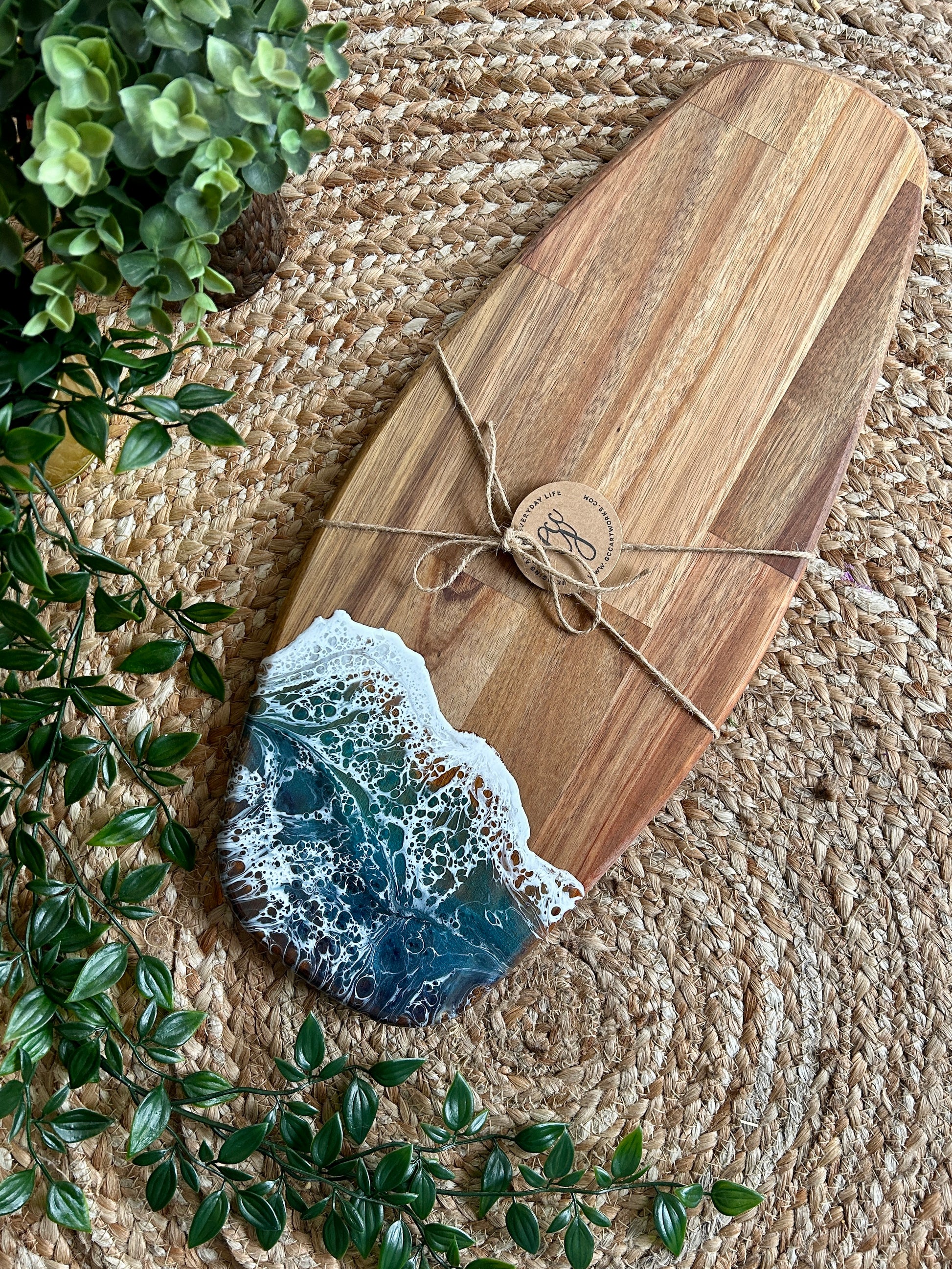Beautiful and functional, bring a touch of seascape resin art to the party hosting with this unique handcrafted acacia wood charcuterie board.