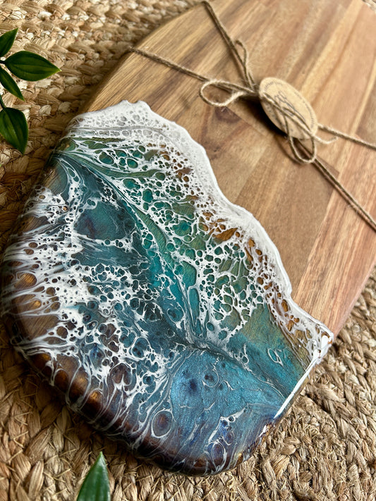 Beautiful and functional, bring a touch of seascape resin art to the party hosting with this unique handcrafted acacia wood charcuterie board.