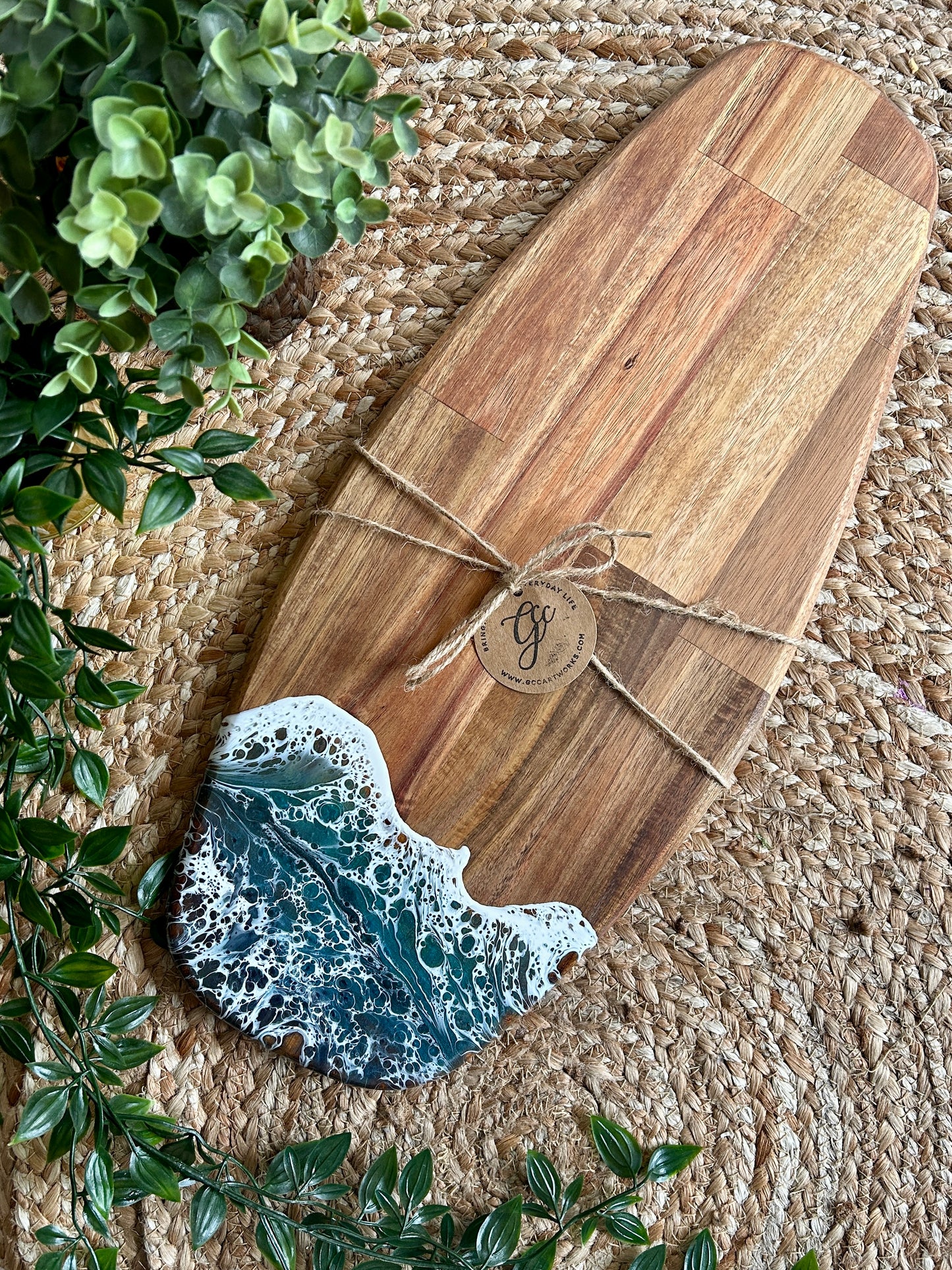 Beautiful and functional, bring a touch of seascape resin art to the party hosting with this unique handcrafted acacia wood charcuterie board. 